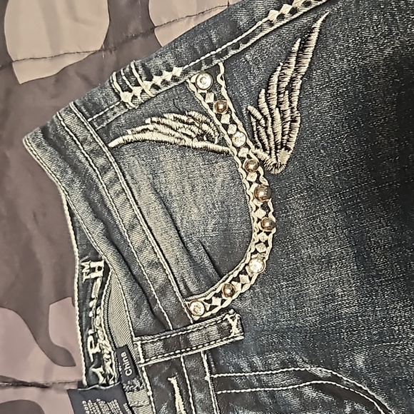 A pair of boot-cut  Platinum Plush jeans - Picture 6 of 11